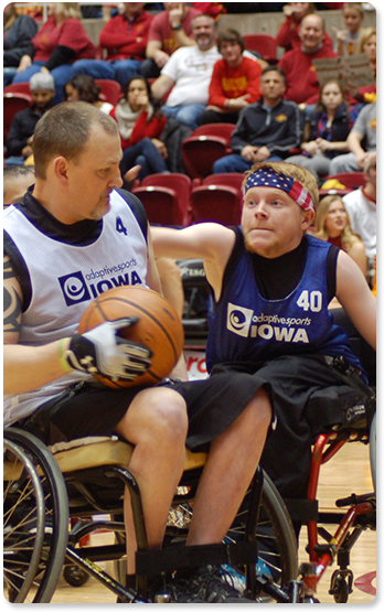 Two basketball players competing for the ball.