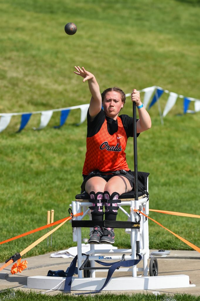 Girl throwing shot put